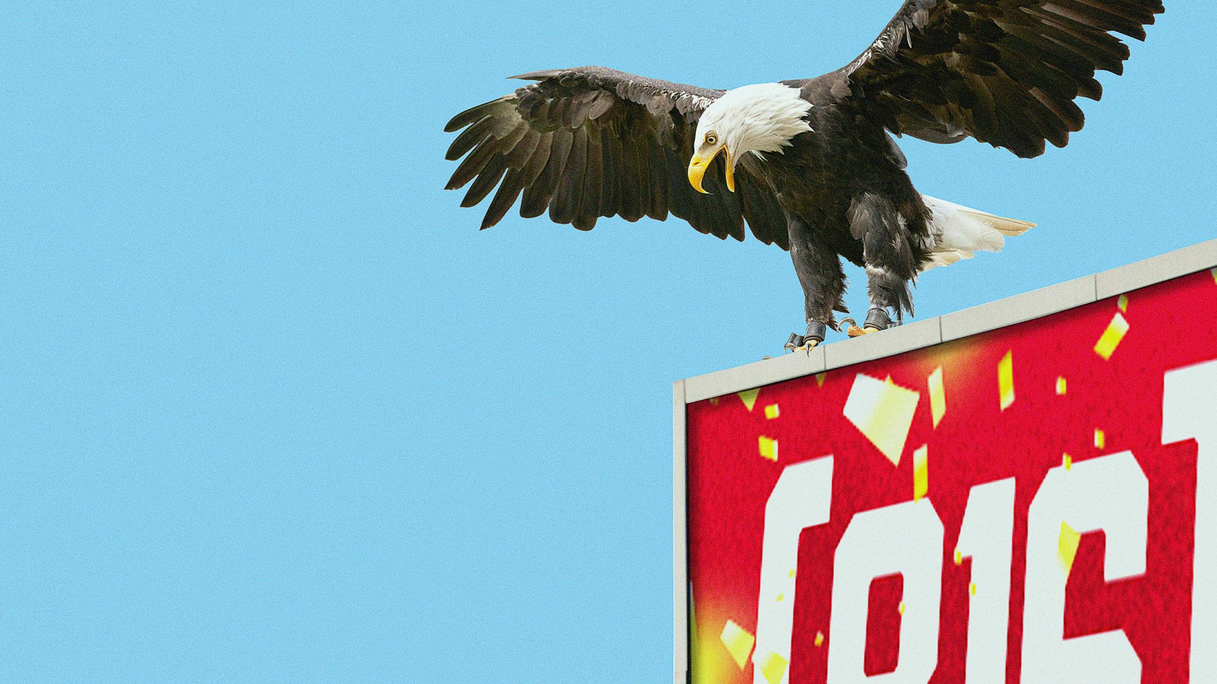 Eagle atop a billboard