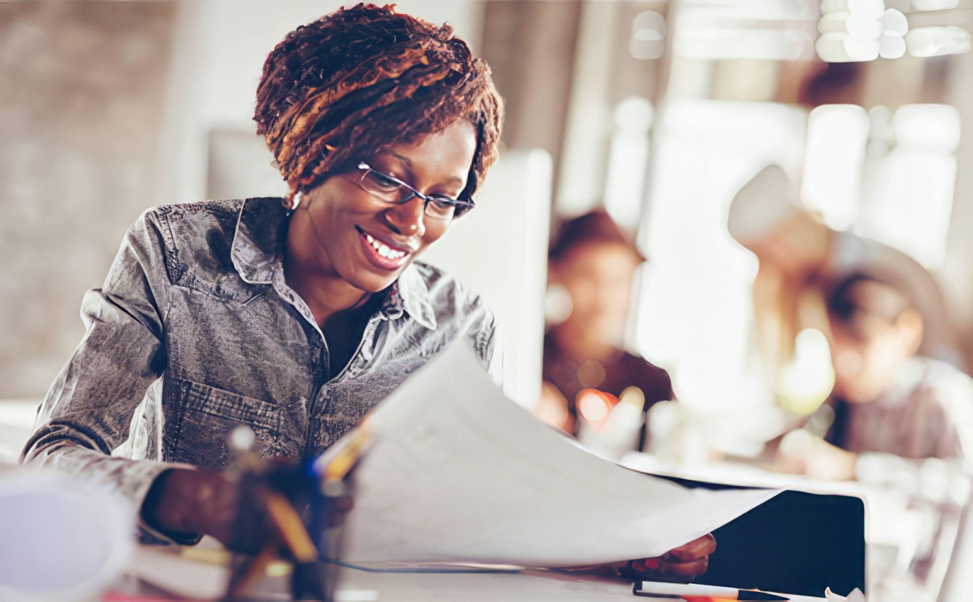 A woman smiling while working