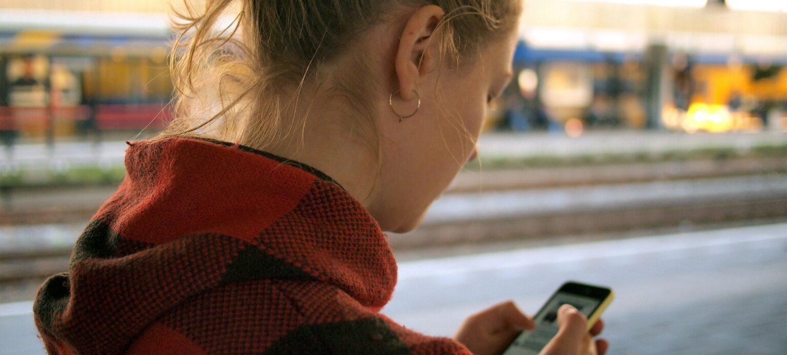 A woman using her cell phone.