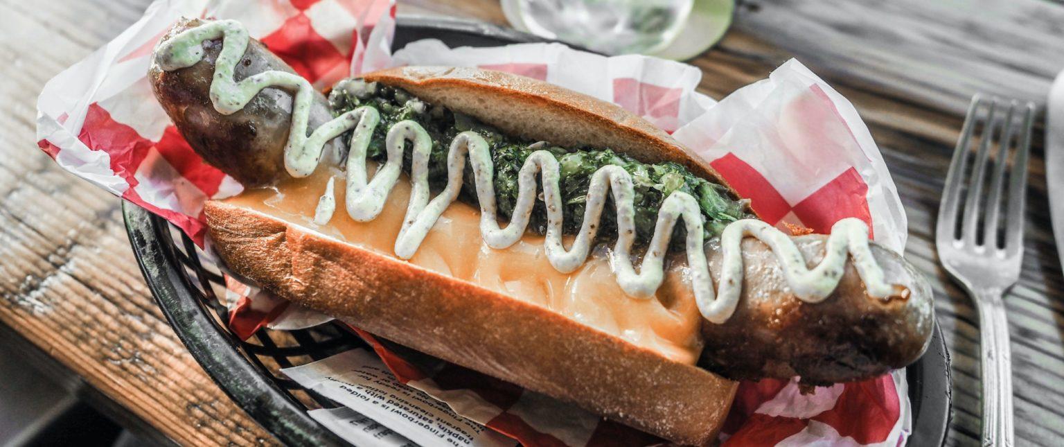 A hot dog with toppings.